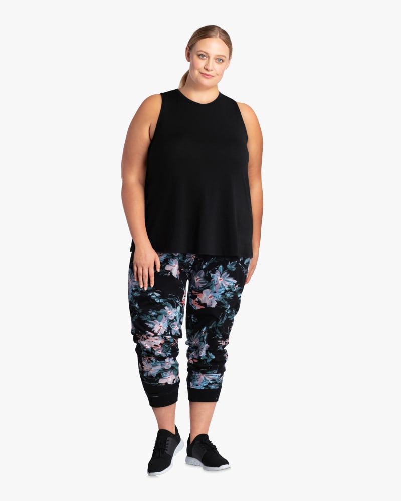 Plus size model with hourglass body shape wearing Piperita Open Twist-Back Tank by Betsey Johnson | Dia&Co | dia_product_style_image_id:114226